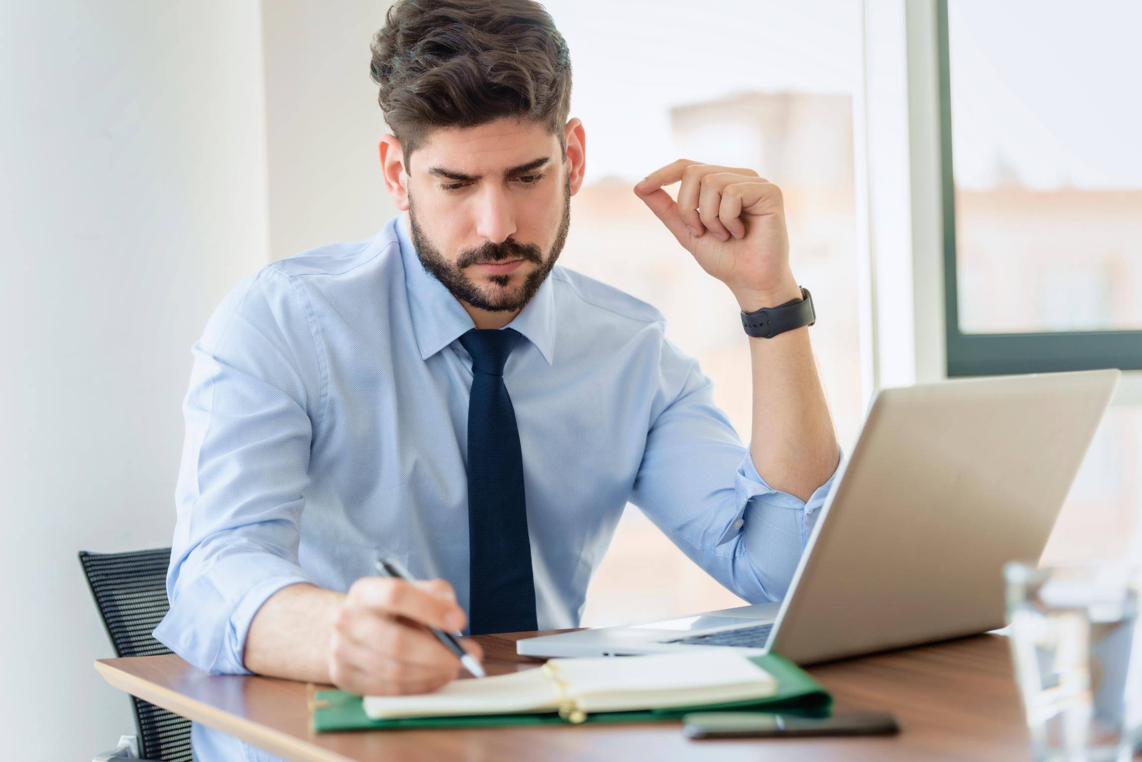 Business man working on a computer at a table