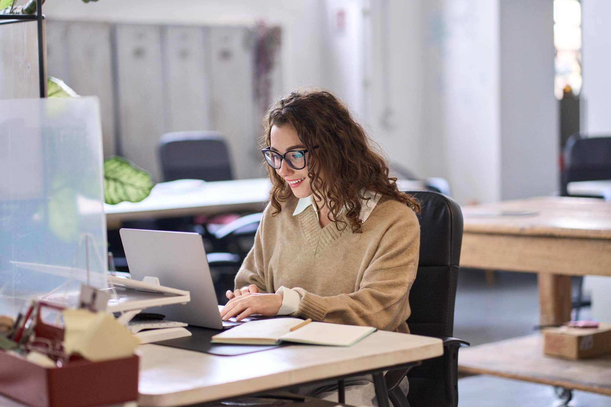 Business people working on a laptop at a desk